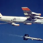 NASA's X-15 rocket plane drops away from its B-52 Stratofortress carrier aircraft beginning its first glide test on June 8, 1959. (Image credit: NASA)